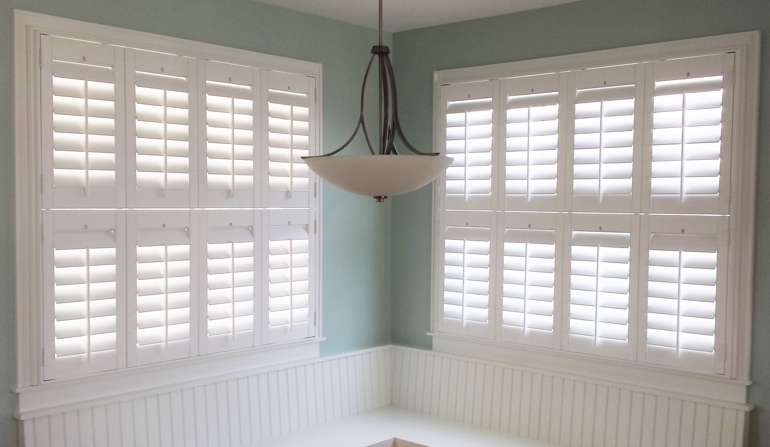 Soft green wall in Sacramento kitchen with shutters.